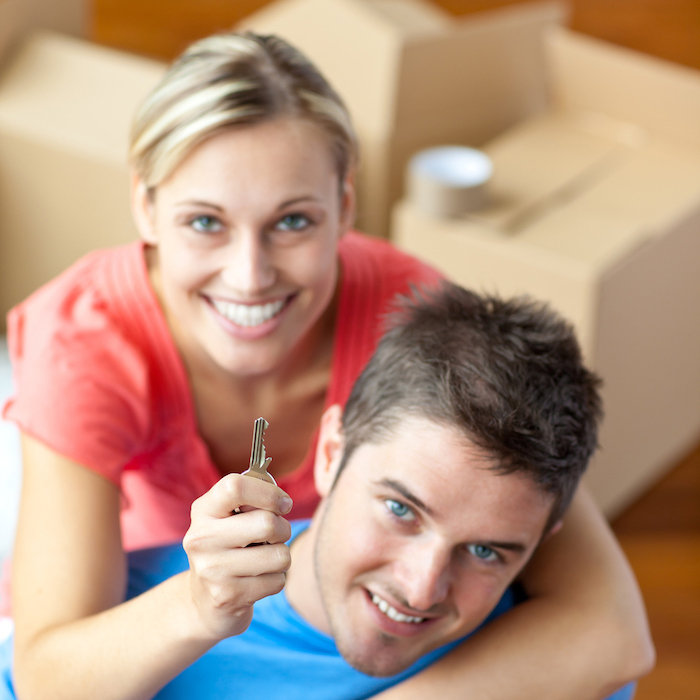 Couple holding a key